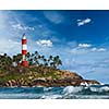 Old lighthouse and waves of  sea. Kovalam (Vizhinjam) Kerala, India