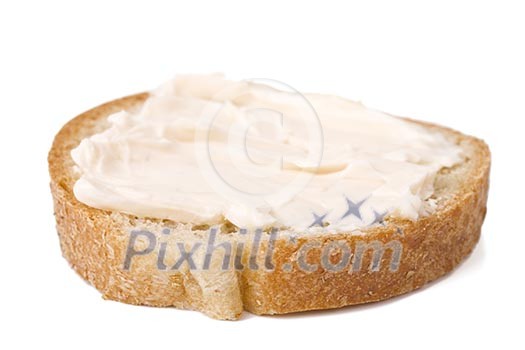 Slice of bread with cheese cream spread on it Slice of bread with cheese cream spread on it