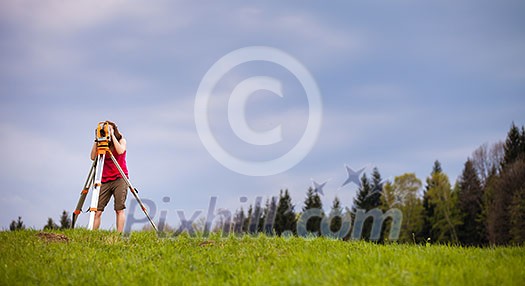 Young land surveyor at work Young land surveyor at work