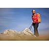 Pretty, young female hiker going uphill