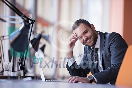 happy young business man portrait in bright modern office indoor happy young business man portrait in bright modern office indoor
