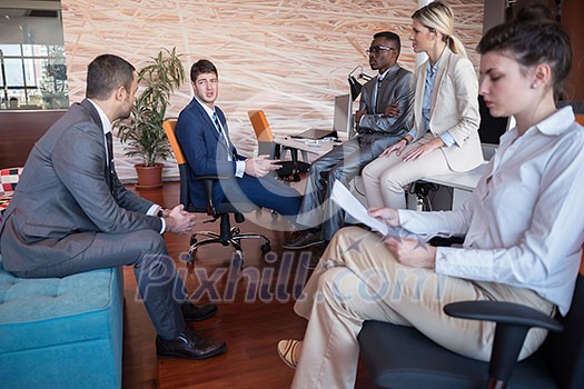 young business people group have meeting and working in modern bright office indoor young business people group have meeting and working in modern bright office indoor