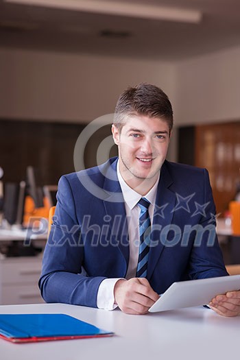 happy young business man portrait in bright modern office indoor happy young business man portrait in bright modern office indoor