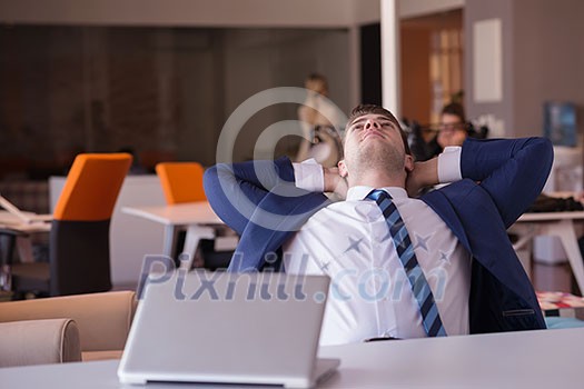 happy young business man portrait in bright modern office indoor happy young business man portrait in bright modern office indoor