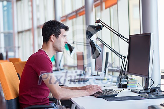 happy young business man portrait in bright modern office indoor happy young business man portrait in bright modern office indoor