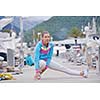 woman jogging at early morning with yacht boats in marina