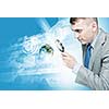 Image of businessman examining objects with magnifier. Elements of this image are furnished by NASA