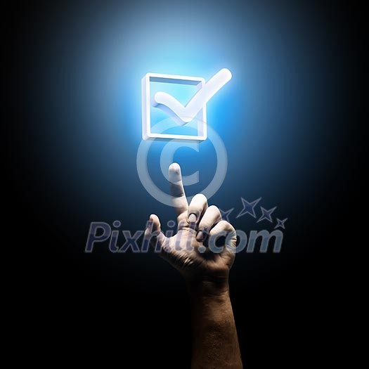 Human hand pointing with finger at tick Human hand pointing with finger at tick
