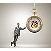 Image of young businessman and pocket watch. Time concept