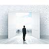 Image of businessman standing in front of opened door