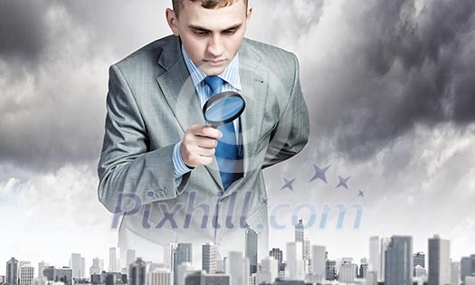 Image of businessman examining objects with magnifier Image of businessman examining objects with magnifier