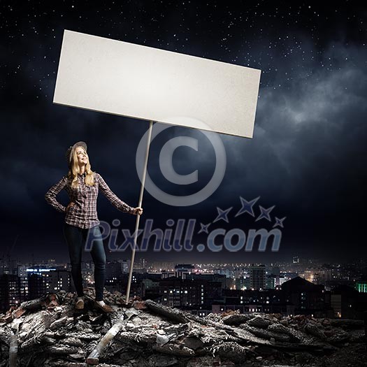 Young woman in casual carrying white blank banner Young woman in casual carrying white blank banner