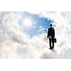 Back view of businessman standing on cloud high in sky