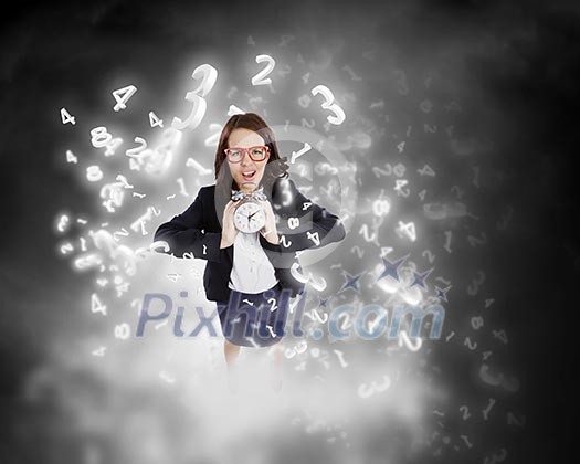 Top view of businesswoman holding alarm clock Top view of businesswoman holding alarm clock