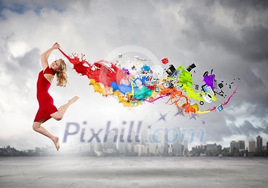 Young woman dancer in red dress jumping high Young woman dancer in red dress jumping high