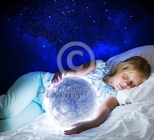 Girl lying in bed with moon in hands Girl lying in bed with moon in hands