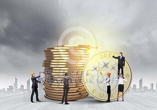 Business people and macro stack of euro coins Business people and macro stack of euro coins