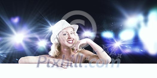 Nude girl standing behind white blank banner. Place for text Nude girl standing behind white blank banner. Place for text