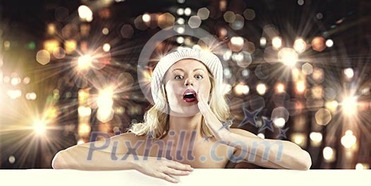 Nude girl standing behind white blank banner. Place for text Nude girl standing behind white blank banner. Place for text