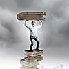 Young man holding huge book above head