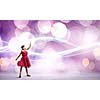 Woman in red dress and blindfold against bokeh background