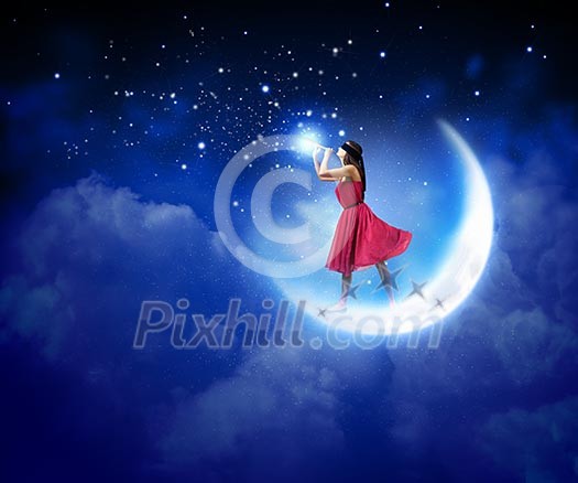 Young woman in red dress wearing blindfold and playing fife Young woman in red dress wearing blindfold and playing fife