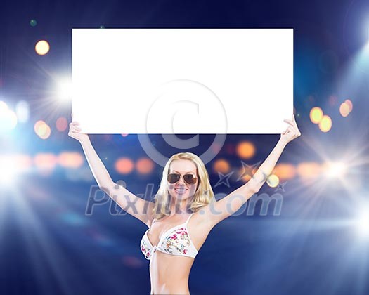 Attractive girl in swimming suit holding white blank banner above head Attractive girl in swimming suit holding white blank banner above head