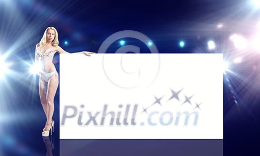 Attractive girl in swimming suit with white blank banner. Place for text Attractive girl in swimming suit with white blank banner. Place for text