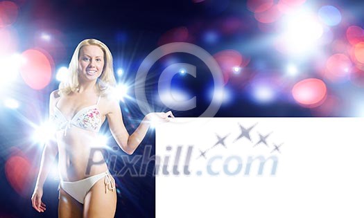 Attractive girl in swimming suit with white blank banner. Place for text Attractive girl in swimming suit with white blank banner. Place for text