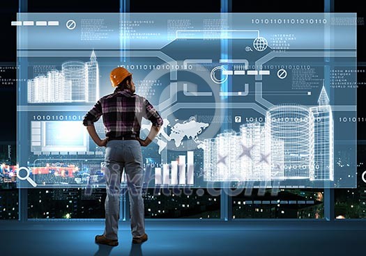 Image of man builder looking at media screen Image of man builder looking at media screen