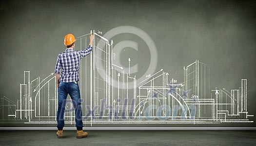 Image of man engineer against building project sketch Image of man engineer against building project sketch