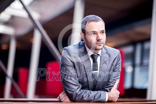 happy young business man portrait in bright modern office indoor happy young business man portrait in bright modern office indoor