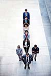 young multi ethnic business people group walking standing and top view