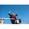 business people running together on racing track