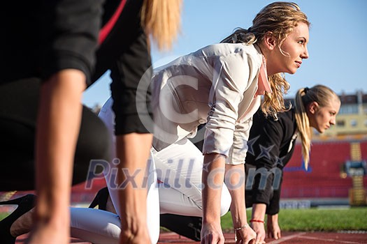 business people running together on racing track business people running together on racing track