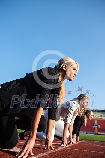 business people running together on racing track business people running together on racing track