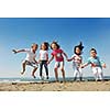 group of happy child on beach who have fun and play games