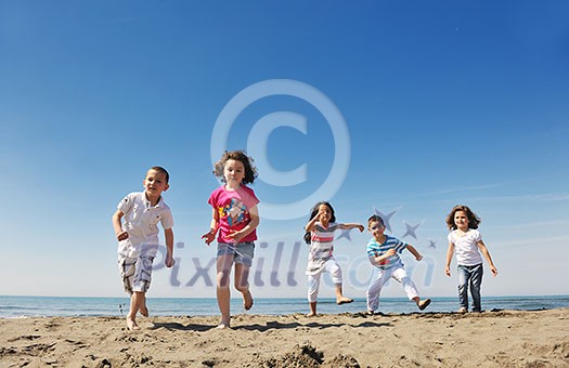 group of happy child on beach who have fun and play games group of happy child on beach who have fun and play games