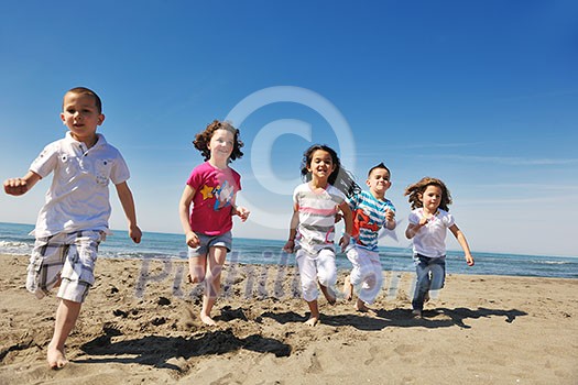 group of happy child on beach who have fun and play games group of happy child on beach who have fun and play games