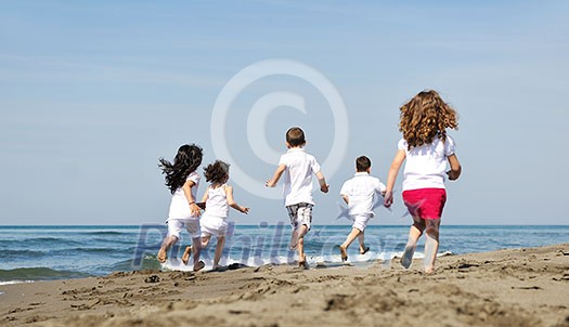group of happy child on beach who have fun and play games group of happy child on beach who have fun and play games