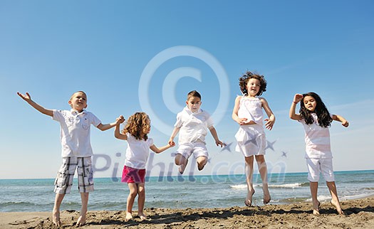 group of happy child on beach who have fun and play games group of happy child on beach who have fun and play games