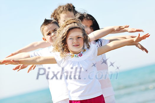group of happy child on beach who have fun and play games group of happy child on beach who have fun and play games