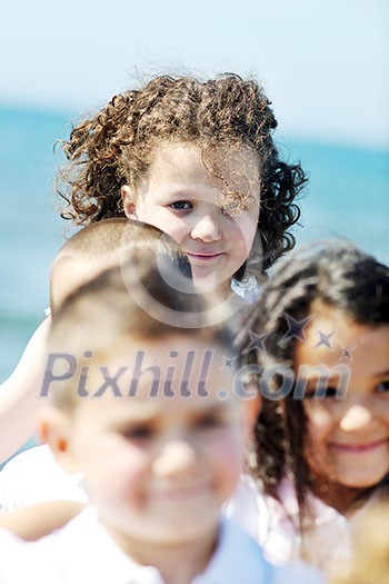 group of happy child on beach who have fun and play games group of happy child on beach who have fun and play games