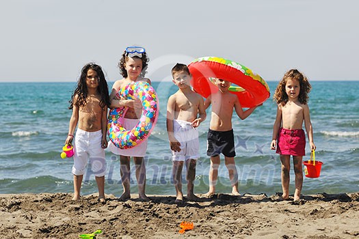 happy child group have fun on beach while playing with toys running jumping happy child group have fun on beach while playing with toys running jumping