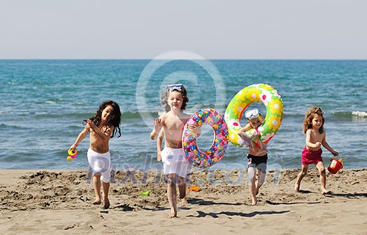 happy child group have fun on beach while playing with toys running jumping happy child group have fun on beach while playing with toys running jumping