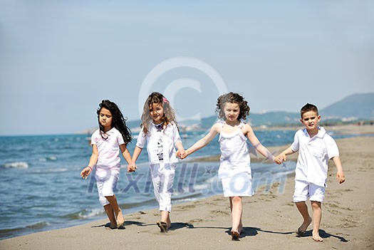 group of happy child on beach who have fun and play games group of happy child on beach who have fun and play games