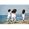 group of happy child on beach who have fun and play games