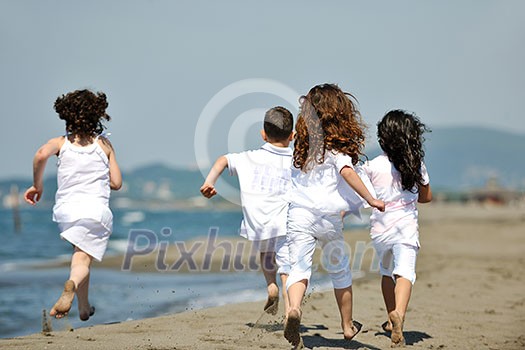 group of happy child on beach who have fun and play games group of happy child on beach who have fun and play games
