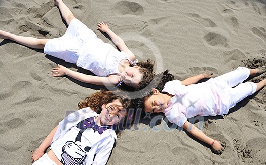 group of happy child on beach who have fun and play games group of happy child on beach who have fun and play games