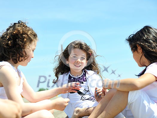 group of happy child on beach who have fun and play games group of happy child on beach who have fun and play games